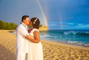 beach wedding photography with rainbow